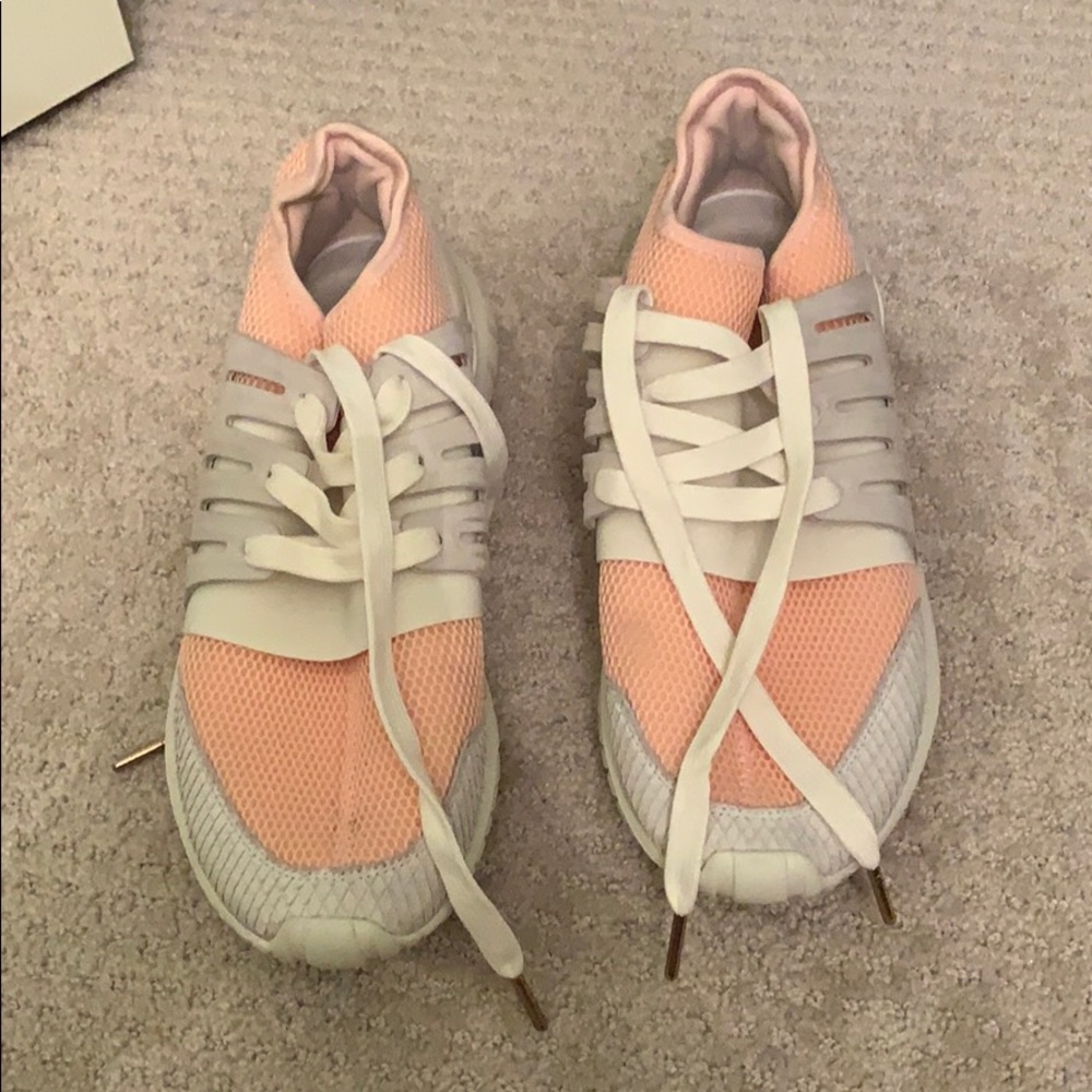 Pink and white adidas shoes